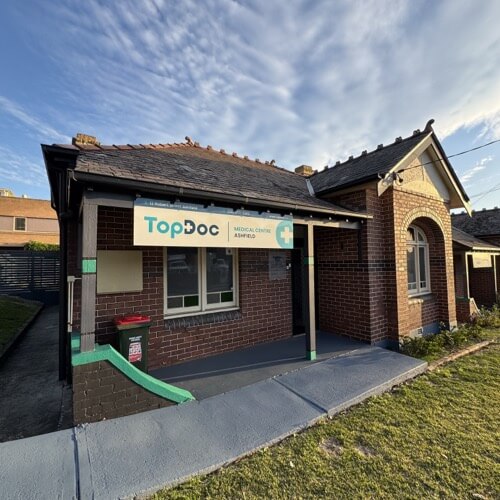 Exterior and entrance of the Ashfield clinic at 12 Robert Street, with the former TopDoc sign